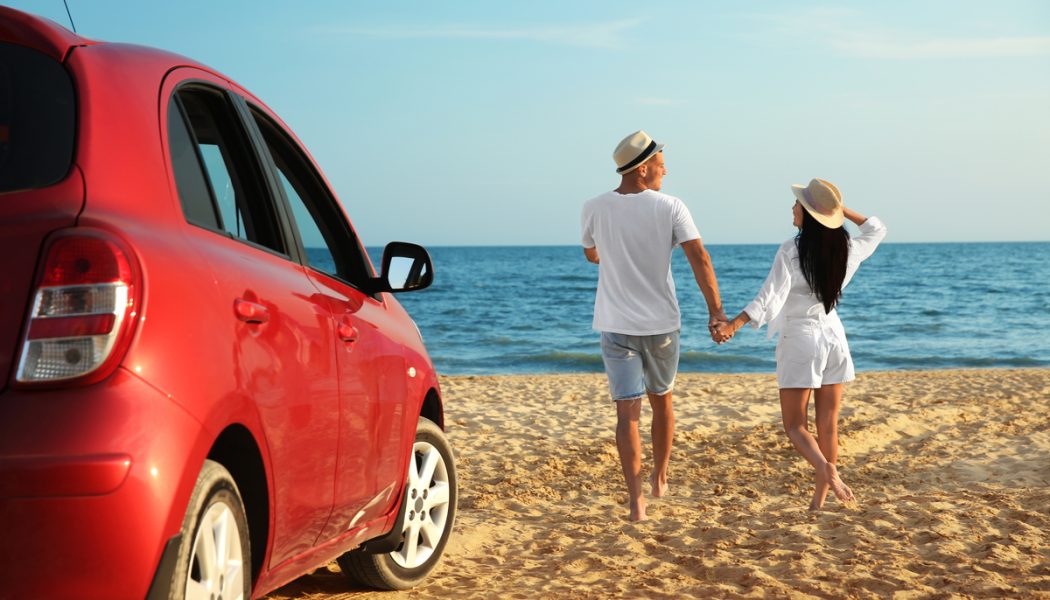 Happy,Couple,Walking,On,Sandy,Beach,,Back,View.,Summer,Trip